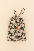 The drawstring bag that holds the 50x50 bamboo blanket. Nature-themed snail, apricot, leaves and branches print on a beige background