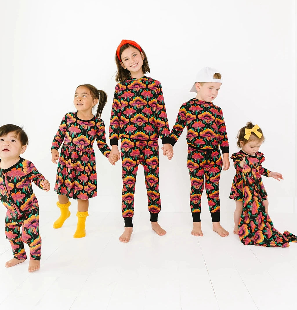 Kids in multiple styles on the same print, a retro floral on black background