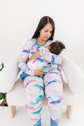 Mom and baby cuddling in pastel peaks matching outfits