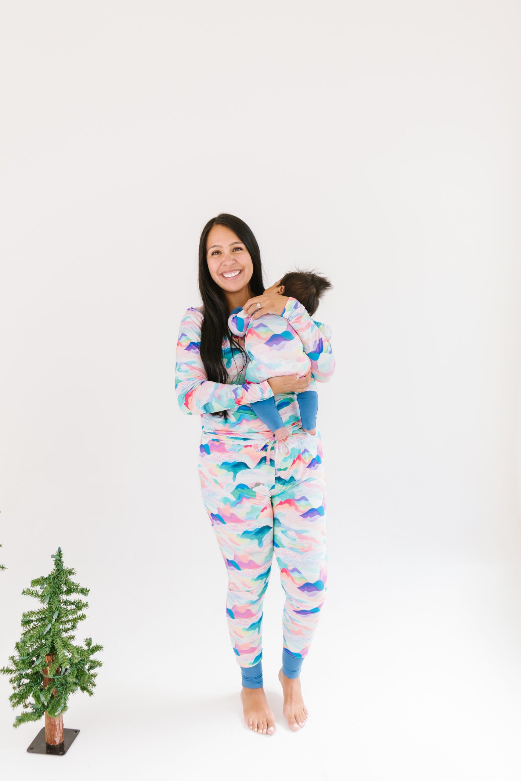 Mom and baby in matching pastel colored mountain peaks outfits