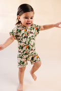 Kid happily wearing bamboo snail shortie and apricot pattern short sleeve and short Romper, Henley buttons