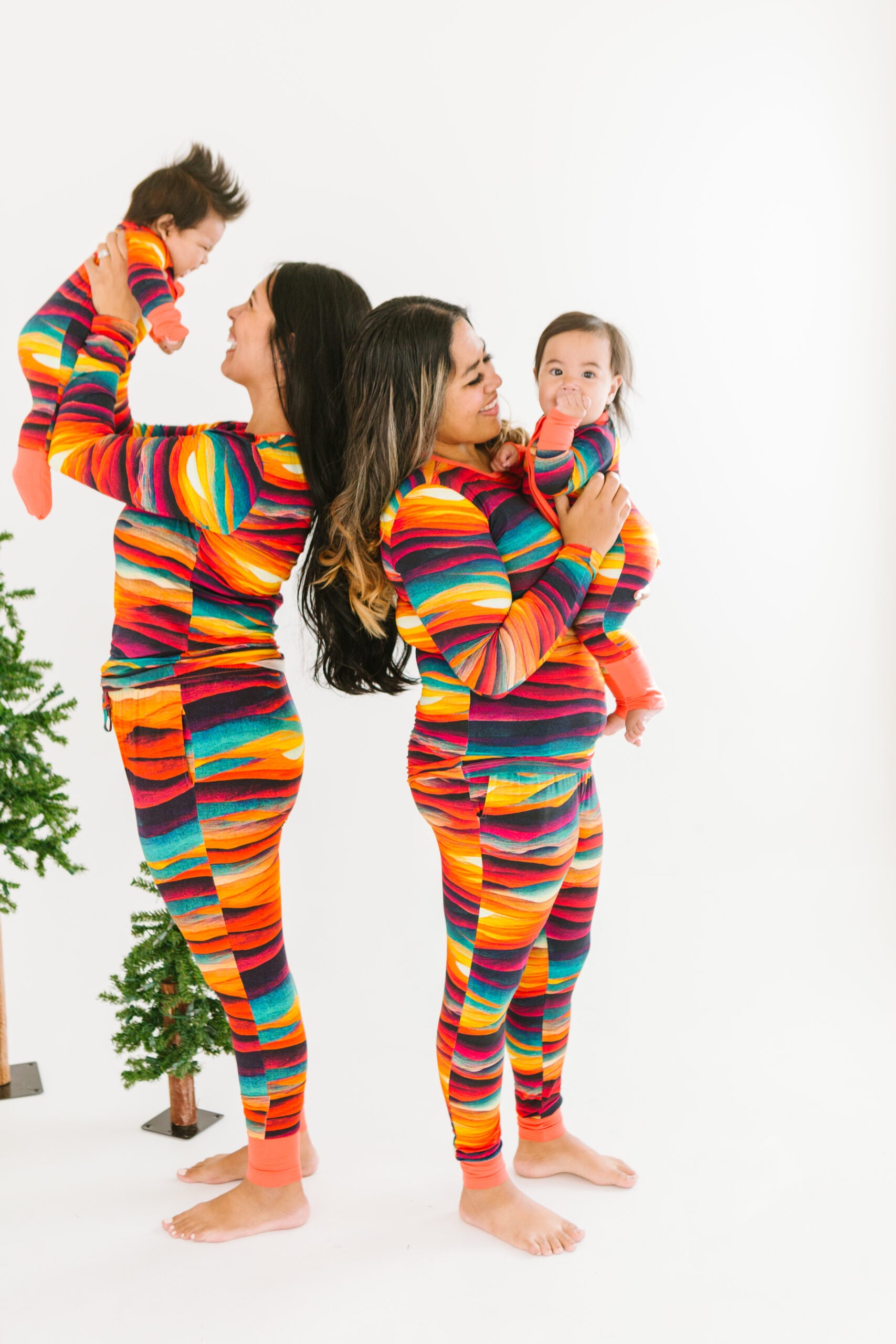 Women and Babies in matching bamboo sets in Sunset print
