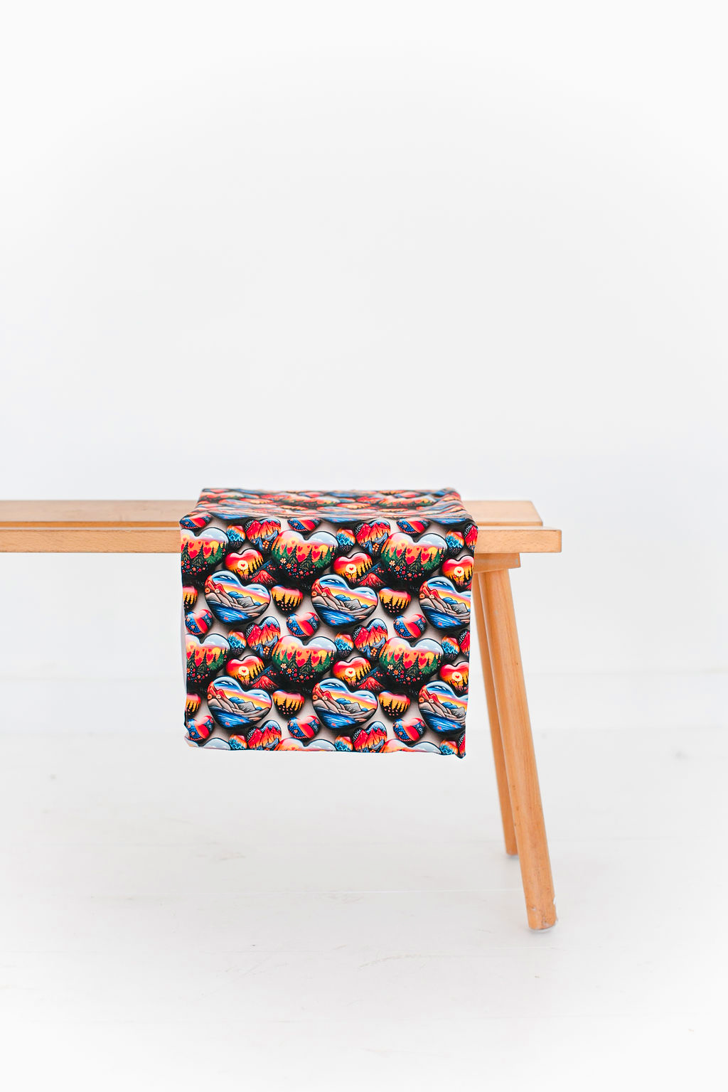 A toddler draping the wild at heart bamboo blanket over his body