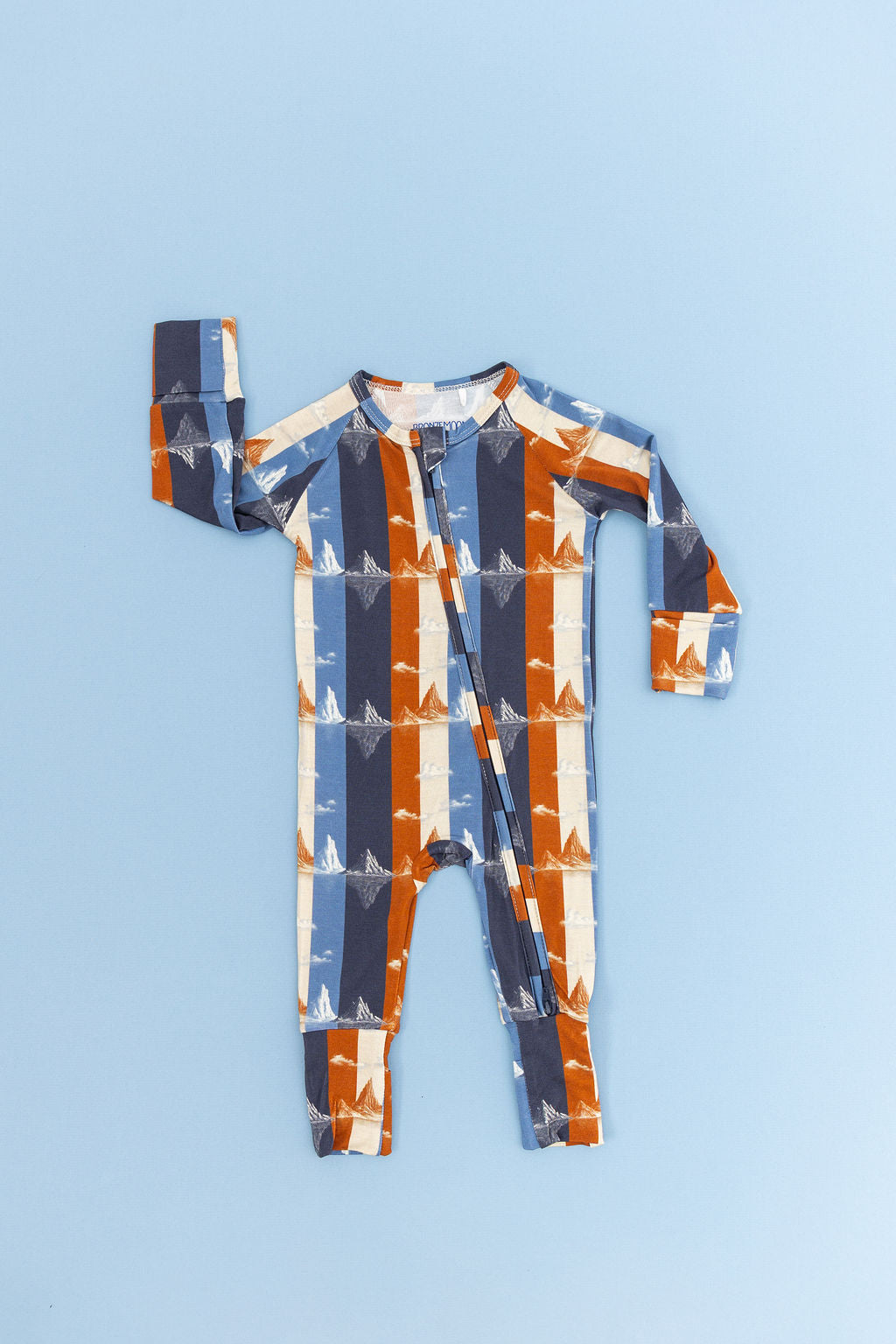 Baby's Romper with Striped mountain pattern on a blue background