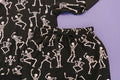 Close up of Kids bamboo jogger set in black Dancing Skelly’s skeleton print.