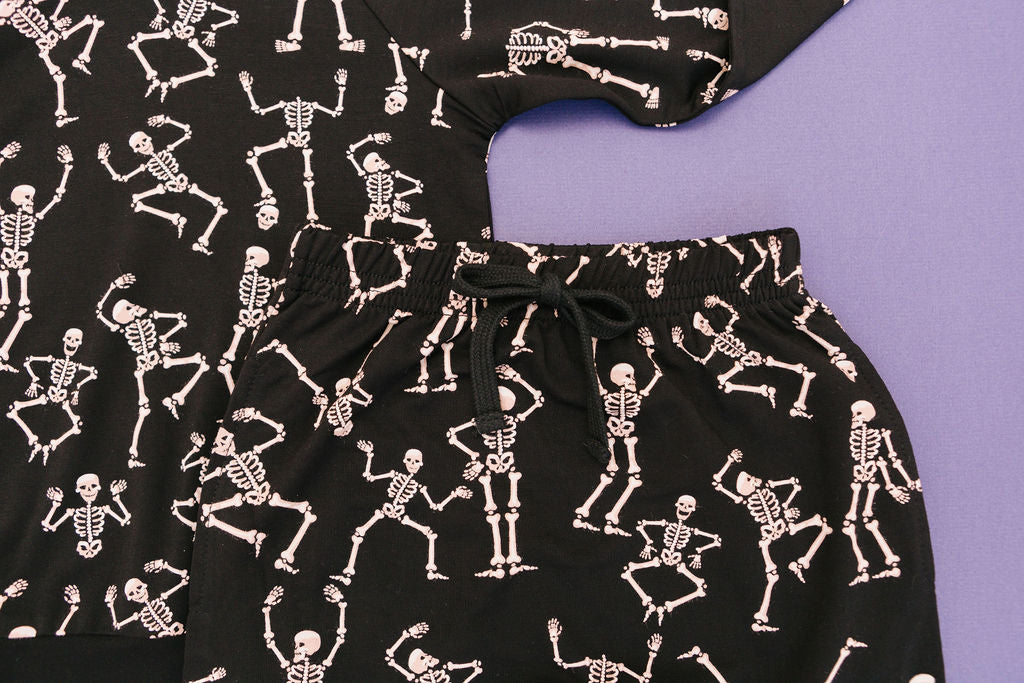 Close up of Kids bamboo jogger set in black Dancing Skelly’s skeleton print.