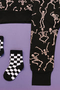 Close up of Kids bamboo jogger set in black Dancing Skelly’s skeleton print.