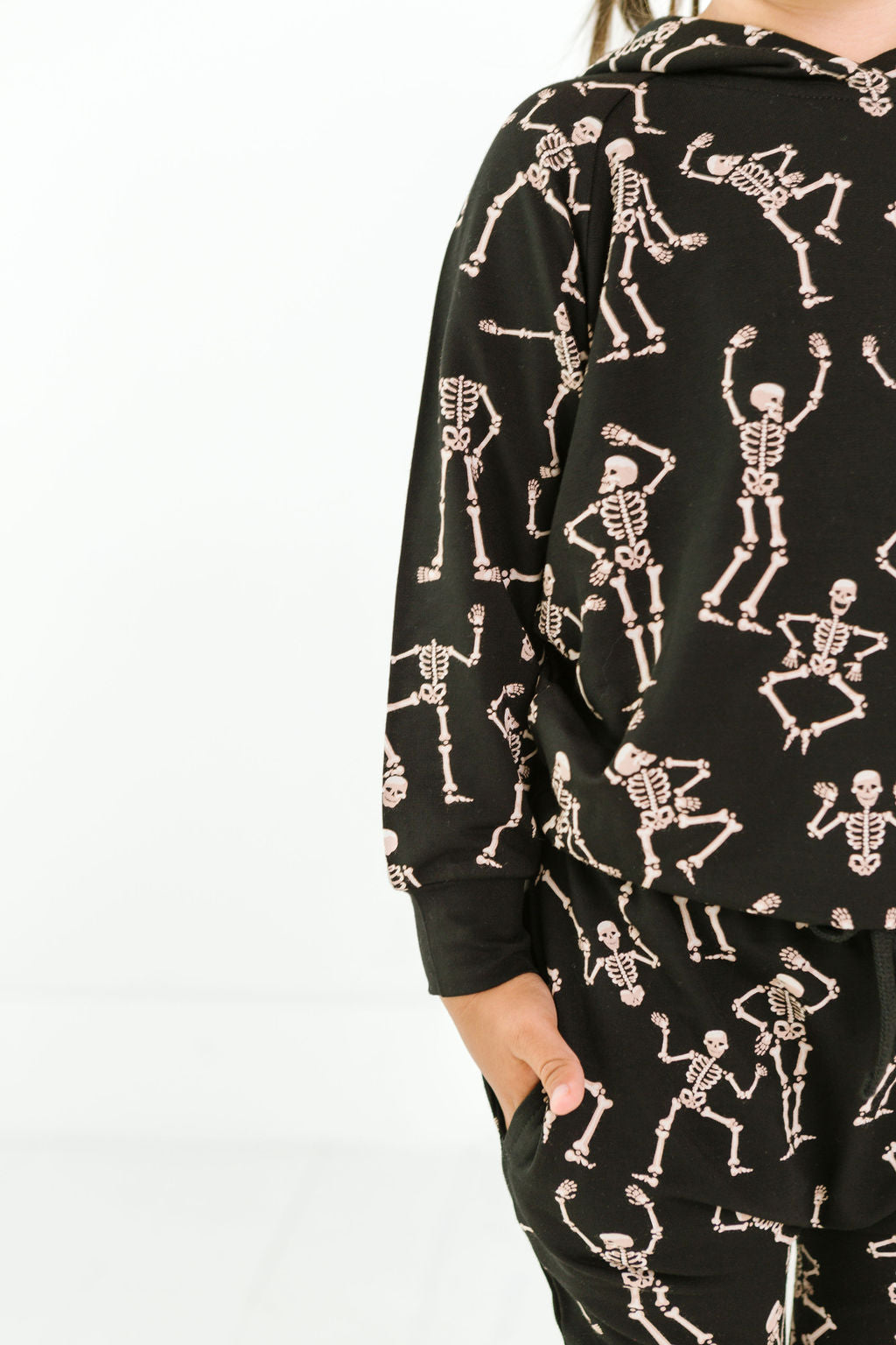 Kids bamboo jogger set in black Dancing Skelly’s skeleton print.