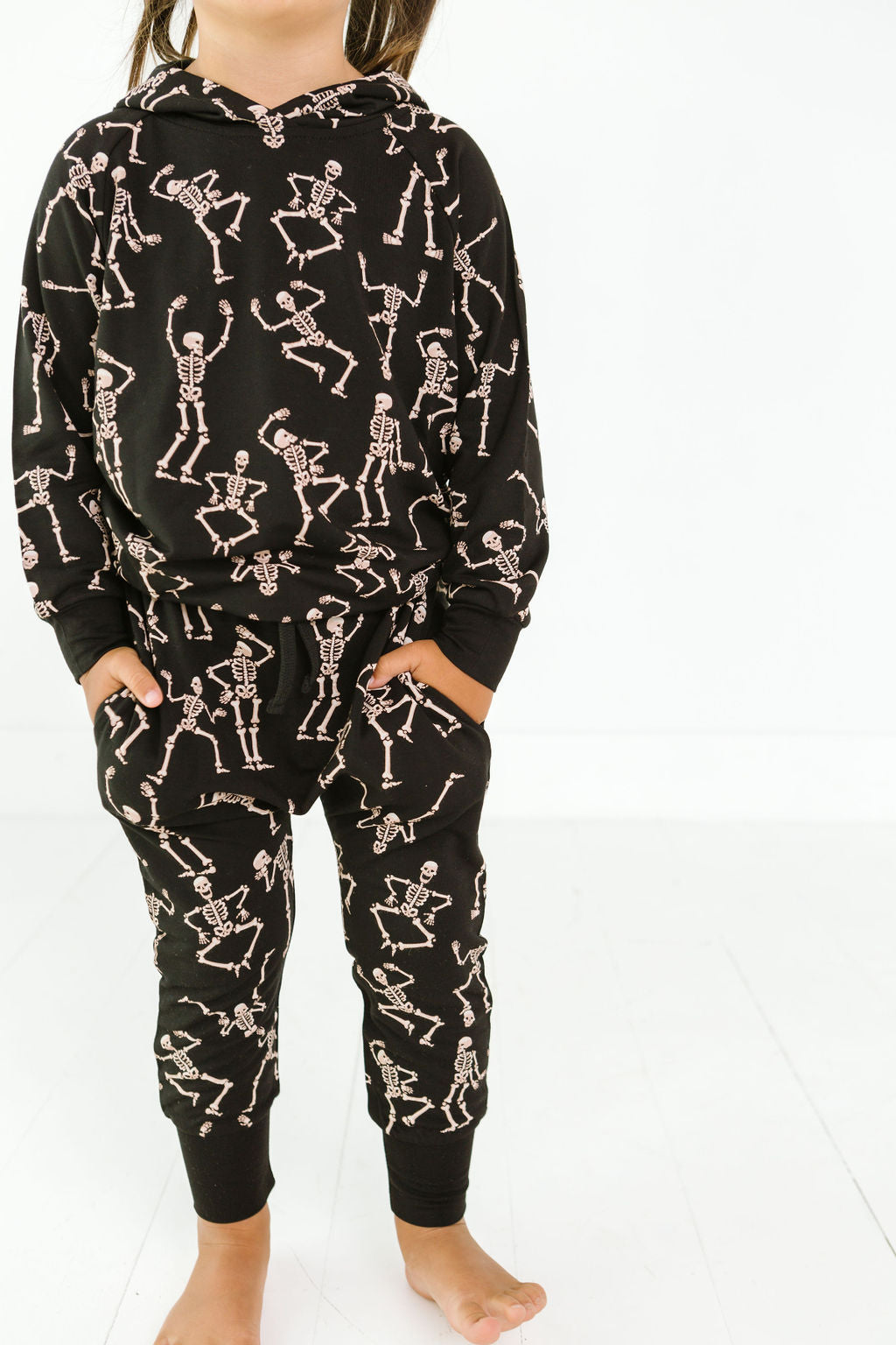 Kids bamboo jogger set in black Dancing Skelly’s skeleton print.